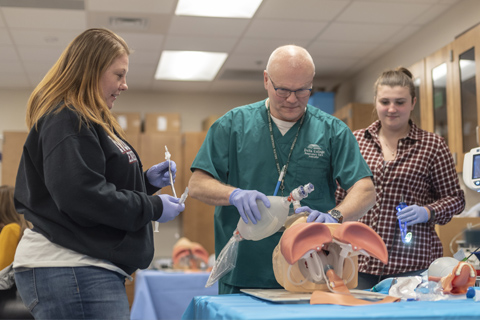 Dan working with students in class.