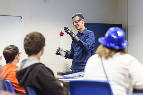 Students watching a demonstration in Astronomy class. 