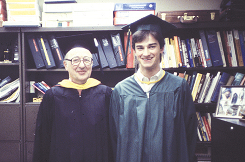 Mark graduates from Delta with his proud father, Clarence, by his side.