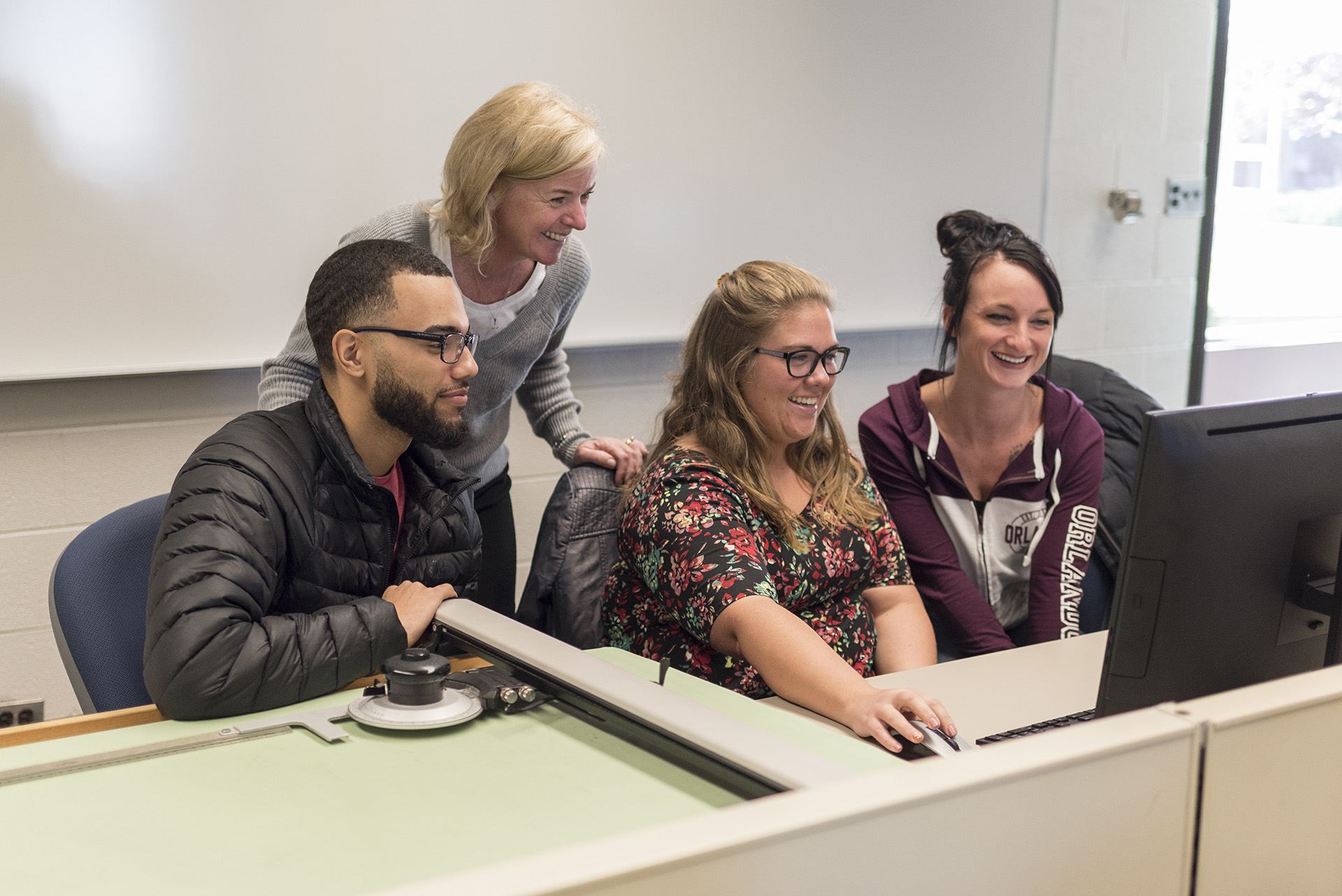 Communication students with instructor