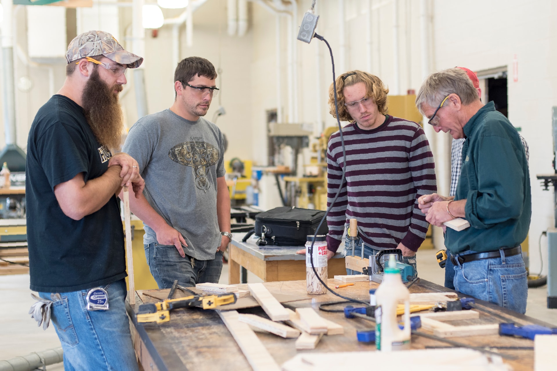 Construction instructor working with students in class.