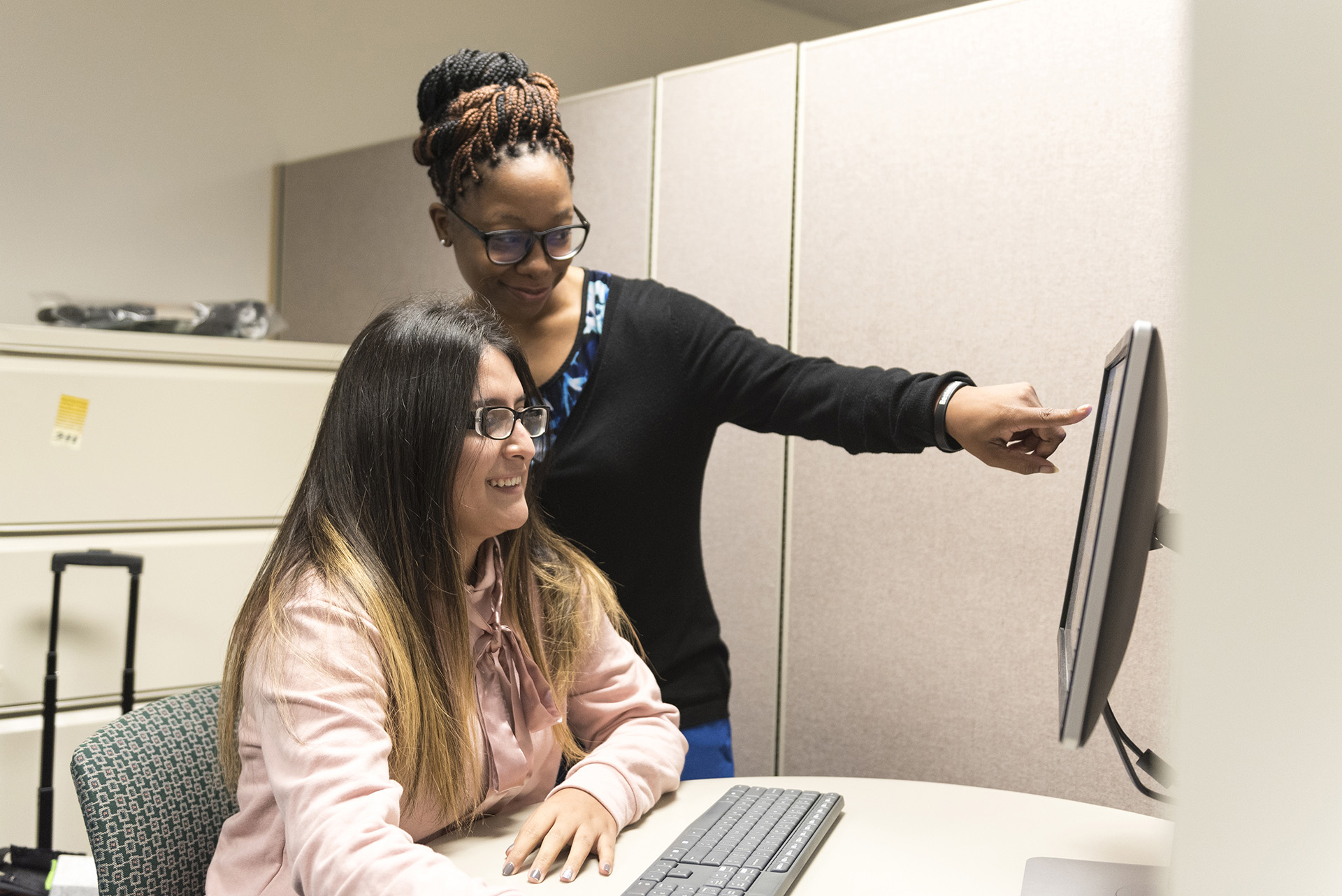 Student with advisors in the Educational Opportunity Center