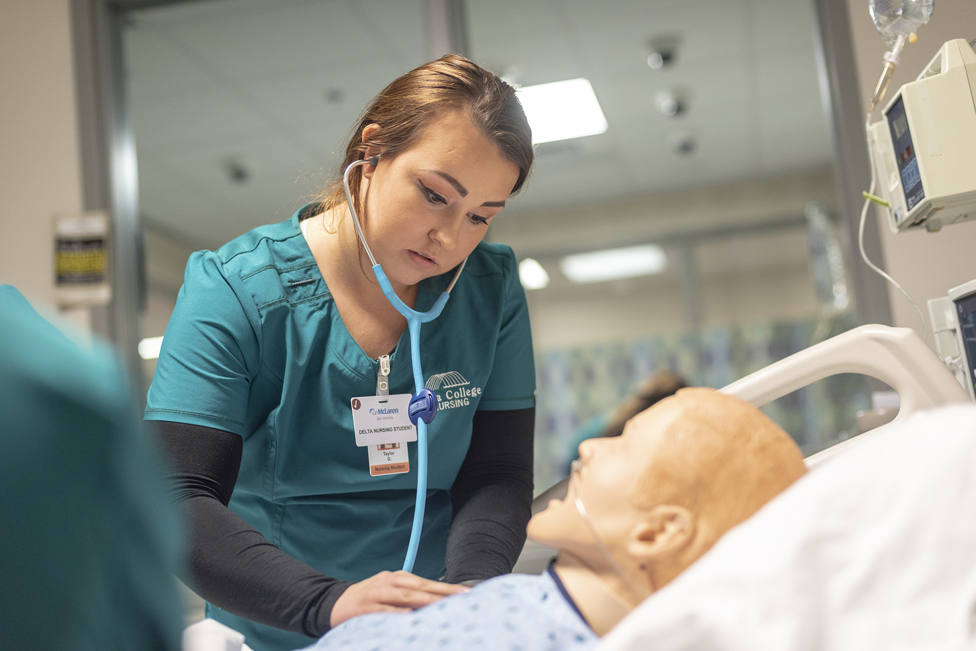 Student working in Nursing SIM lab