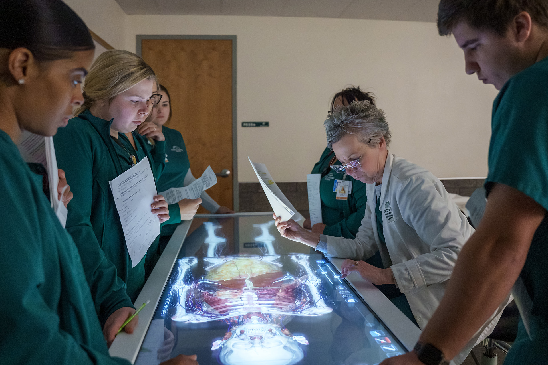 Students around anatomage table