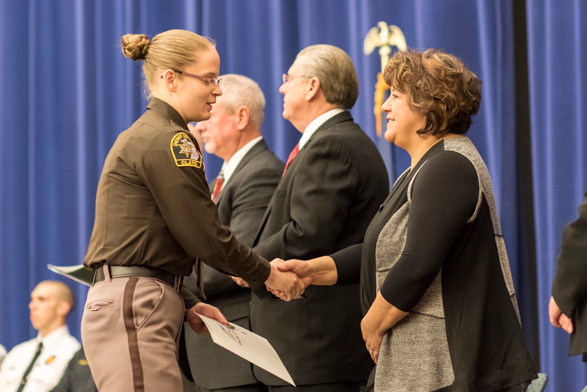 Alumni receiving an award