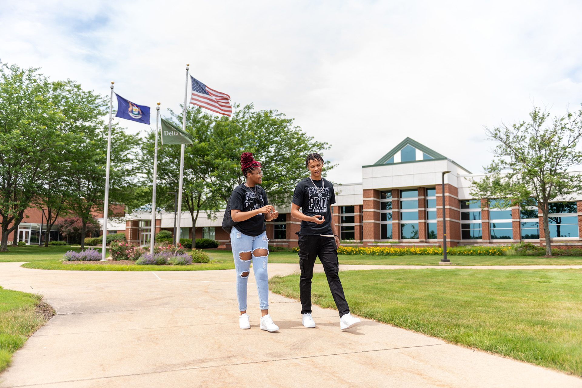 Delta College students working outside in the grass.