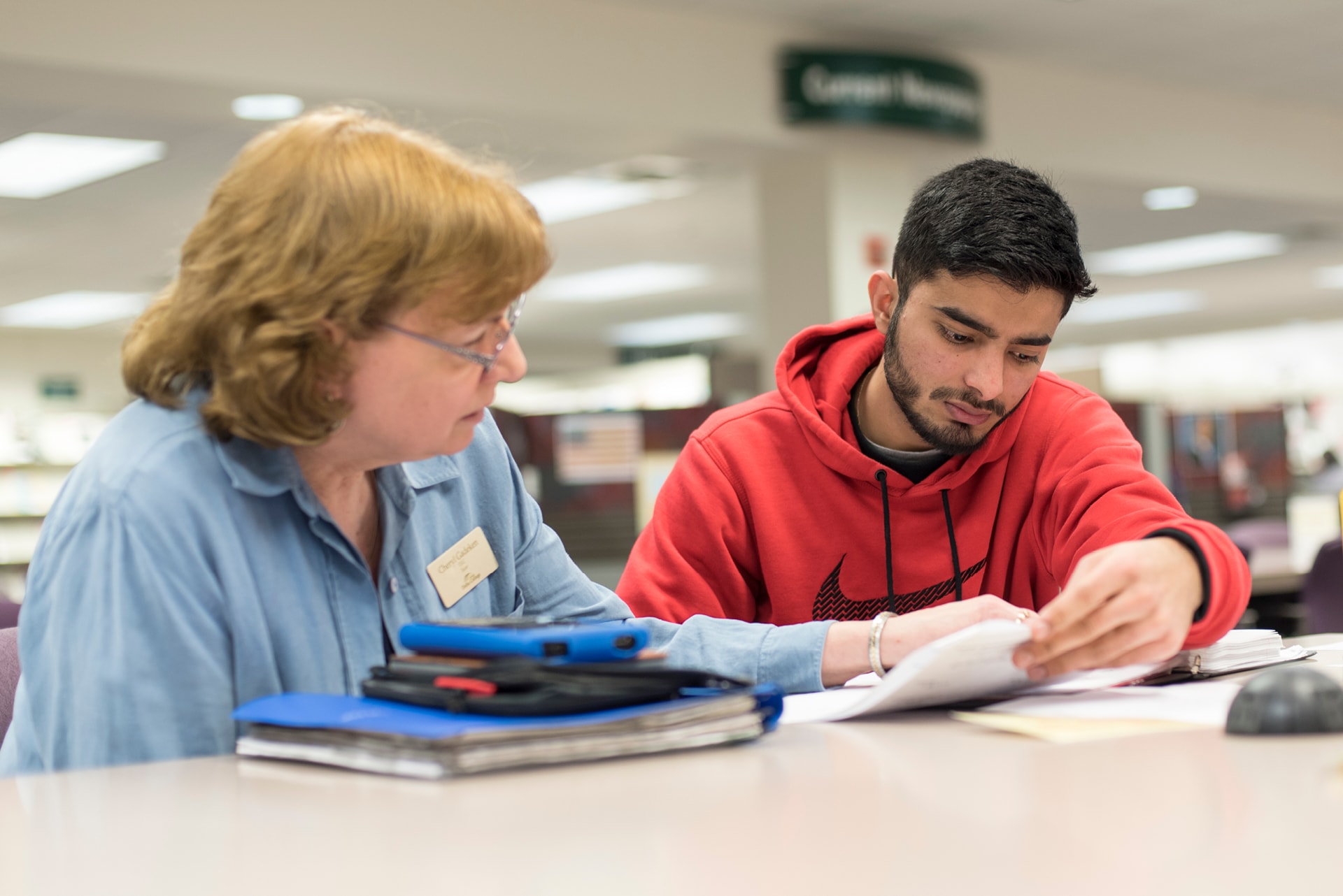 Tutor assisting student.