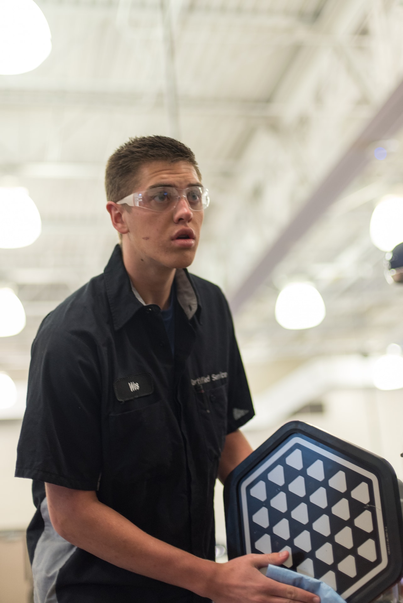 Automotive student working in lab.