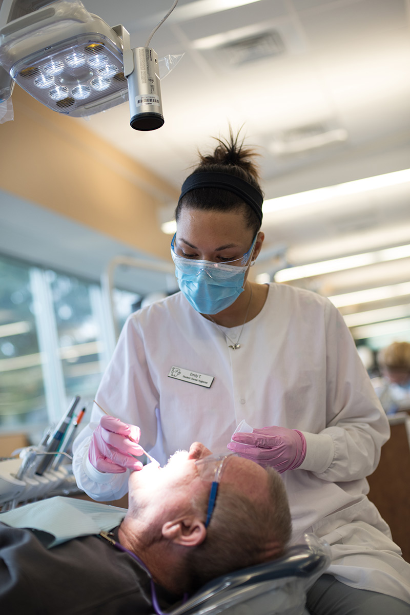 Dental clinic student with patient